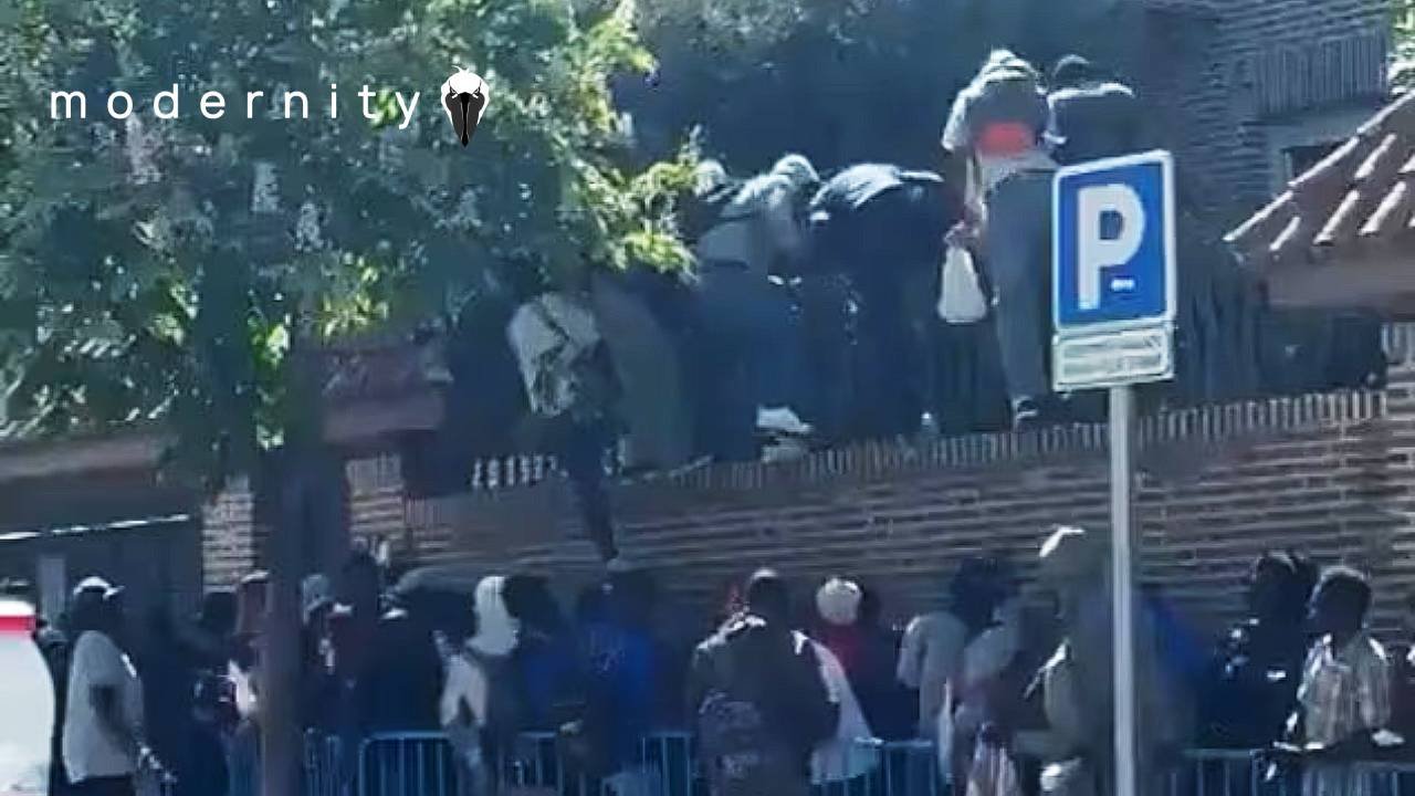 Watch: Migrants Are Literally Clambering Up Embassy Walls In Spain - modernity
